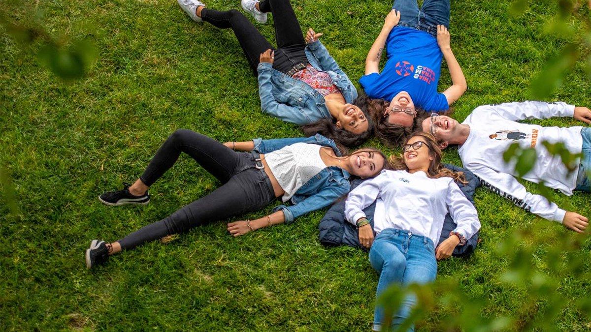 students relax outside