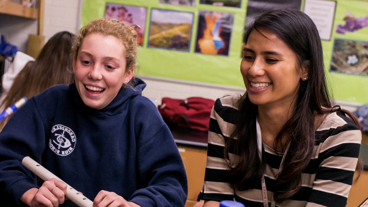 A teacher and student working together